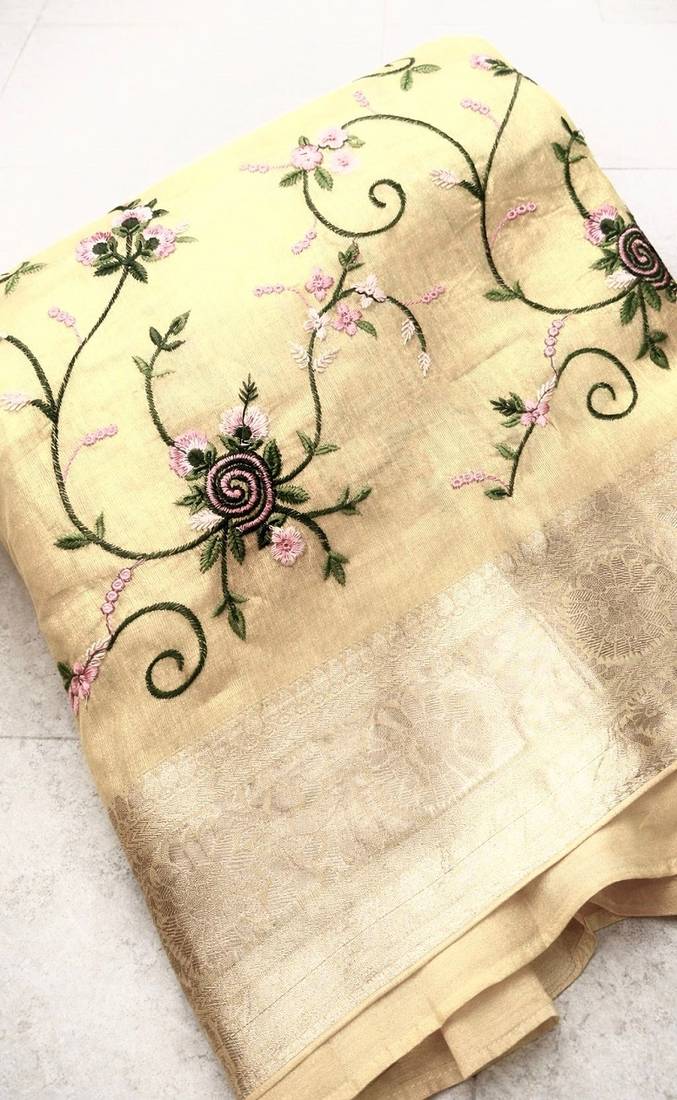 golden color floral tissue saree