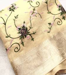 golden color floral tissue saree
