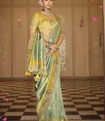 Silk blend saree in mint green & mustard yellow with meenakari zari weaving