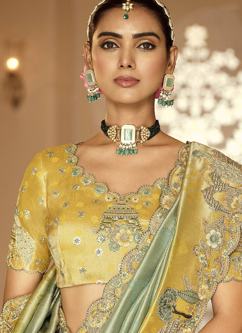 Silk blend saree in mint green & mustard yellow with meenakari zari weaving