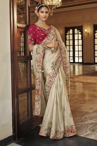 Silk blend saree in ivory white with rani pink contrast blouse & meenakari zari borders