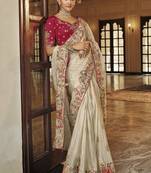 Silk blend saree in ivory white with rani pink contrast blouse & meenakari zari borders