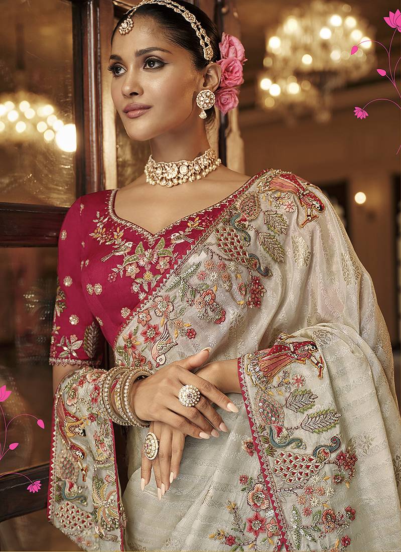 Silk blend saree in ivory white with rani pink contrast blouse & meenakari zari borders