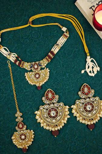 Gold plated kundan maroon jadau peacock necklace maang tikka set