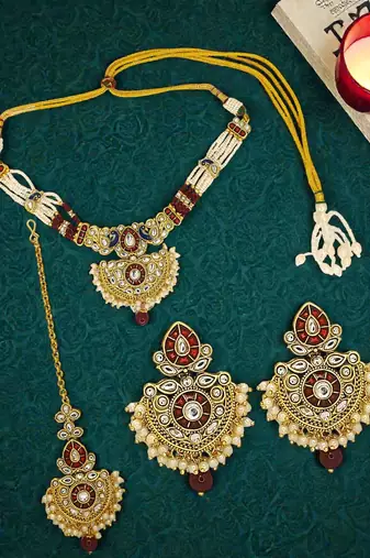 Gold plated kundan maroon jadau peacock necklace maang tikka set