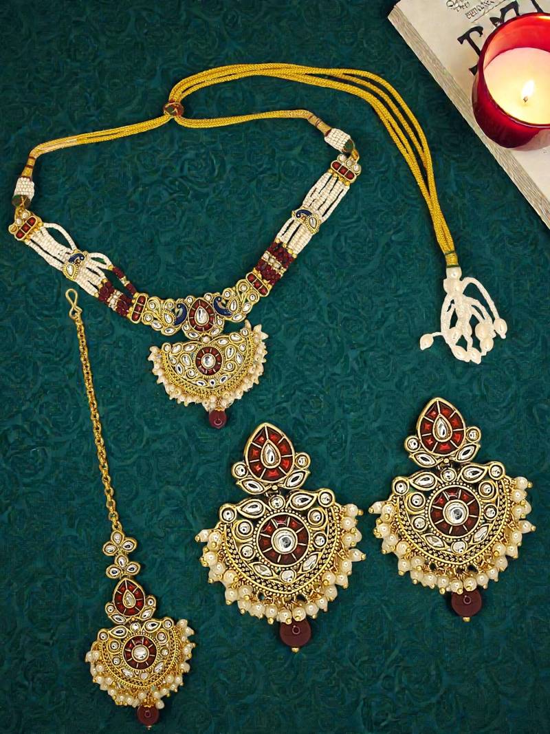 Gold plated kundan maroon jadau peacock necklace maang tikka set