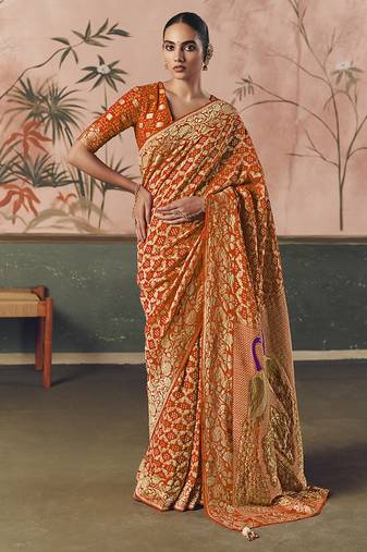 Orange bandhej weaving work faux khaddi georgette saree