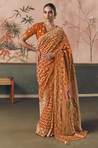 Orange bandhej weaving work faux khaddi georgette saree