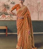 Orange bandhej weaving work faux khaddi georgette saree