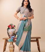 teal color woven work lichi art silk blend saree