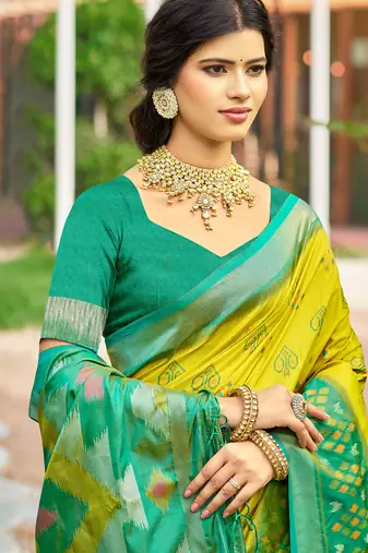 green woven work pochampally art silk blend saree