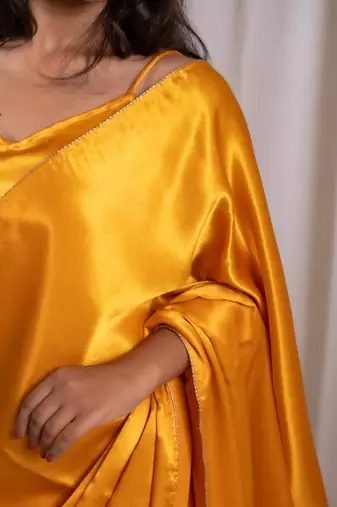 yellow cutdana border satin embroidered saree with stitched blouse