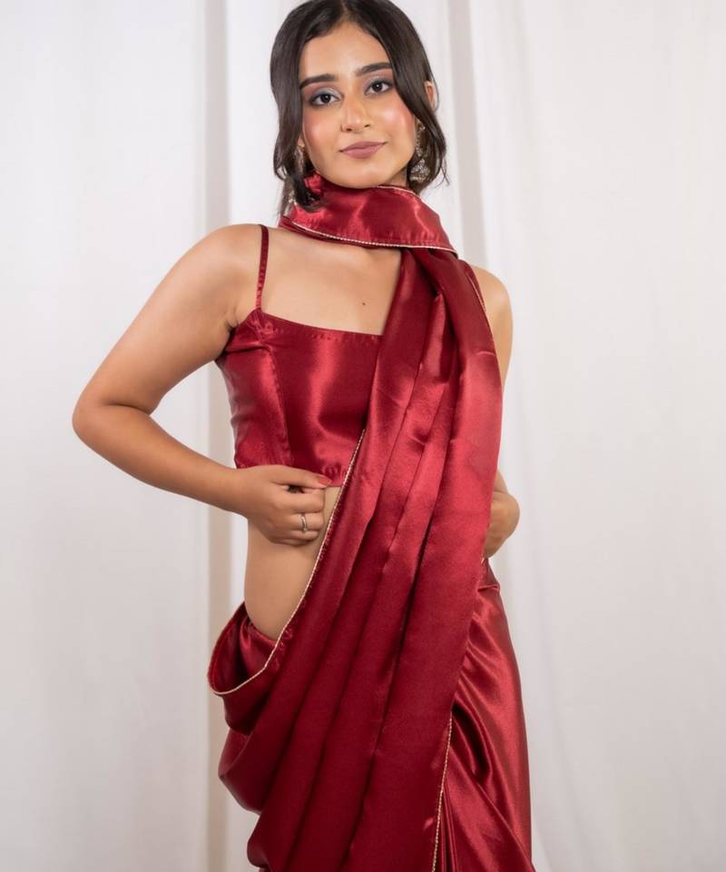 Red cutdana border satin embroidered saree with stitched blouse