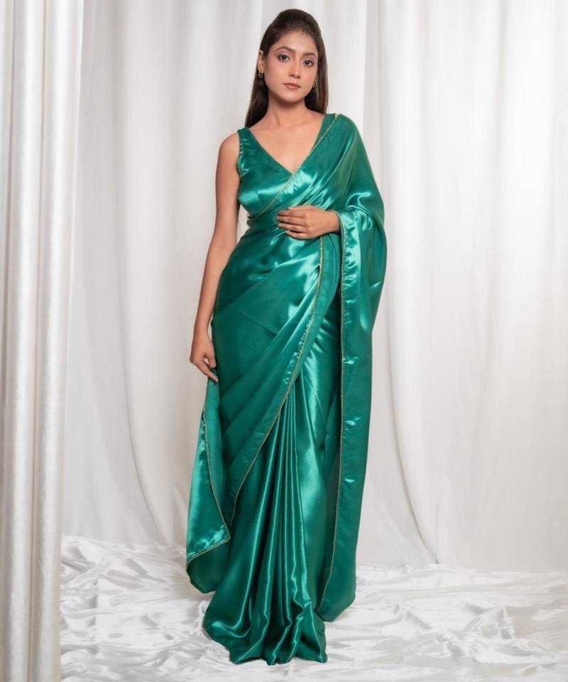 Bottle green cutdana border satin embroidered saree with stitched blouse