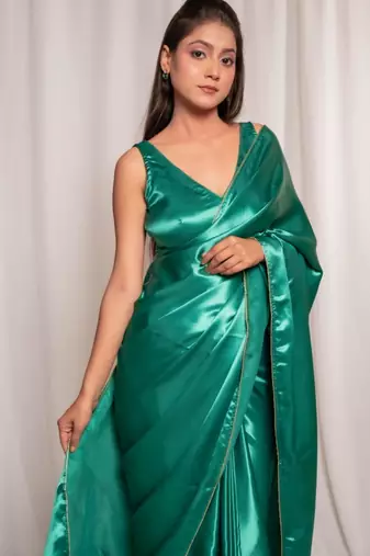 bottle green cutdana border satin embroidered saree with stitched blouse