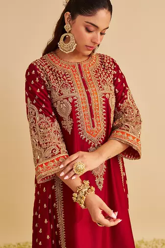 Red embroidered silk kurta set with dupatta