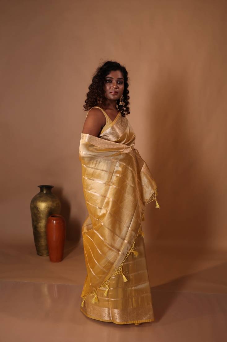 yellow embroidered tissue saree