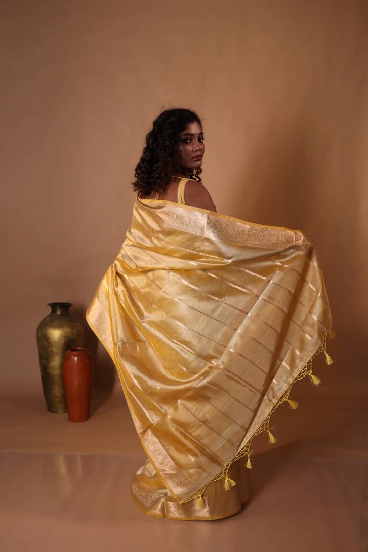 yellow embroidered tissue saree