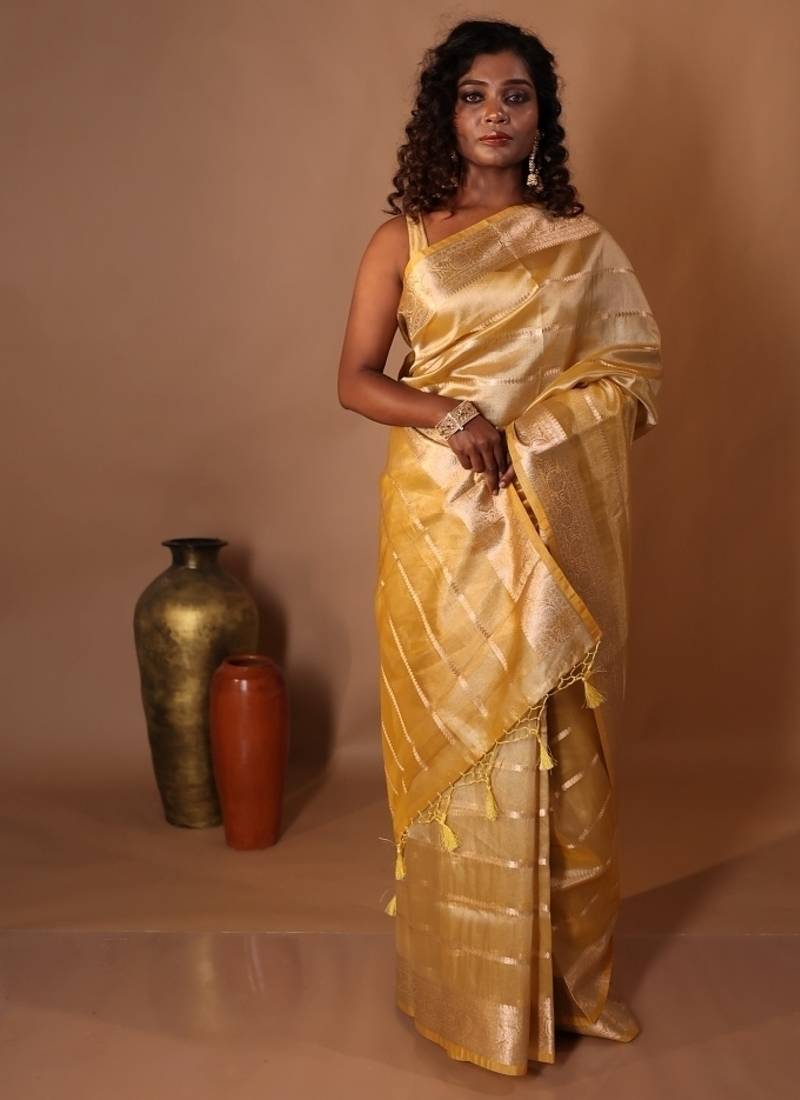 yellow embroidered tissue saree