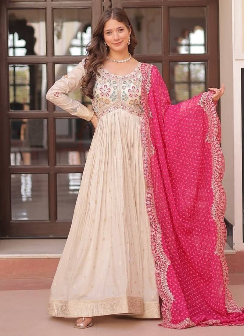 Off-white jacquard gown with pink dupatta
