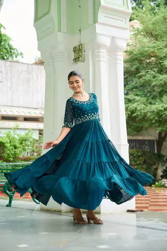 Blue designer faux blooming embroidered gown with bead work