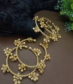 Set of 4 gold-plated twisted kada bracelet with clustered ghungroo charms