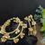 Set of 4 gold-plated twisted kada bracelet with clustered ghungroo charms