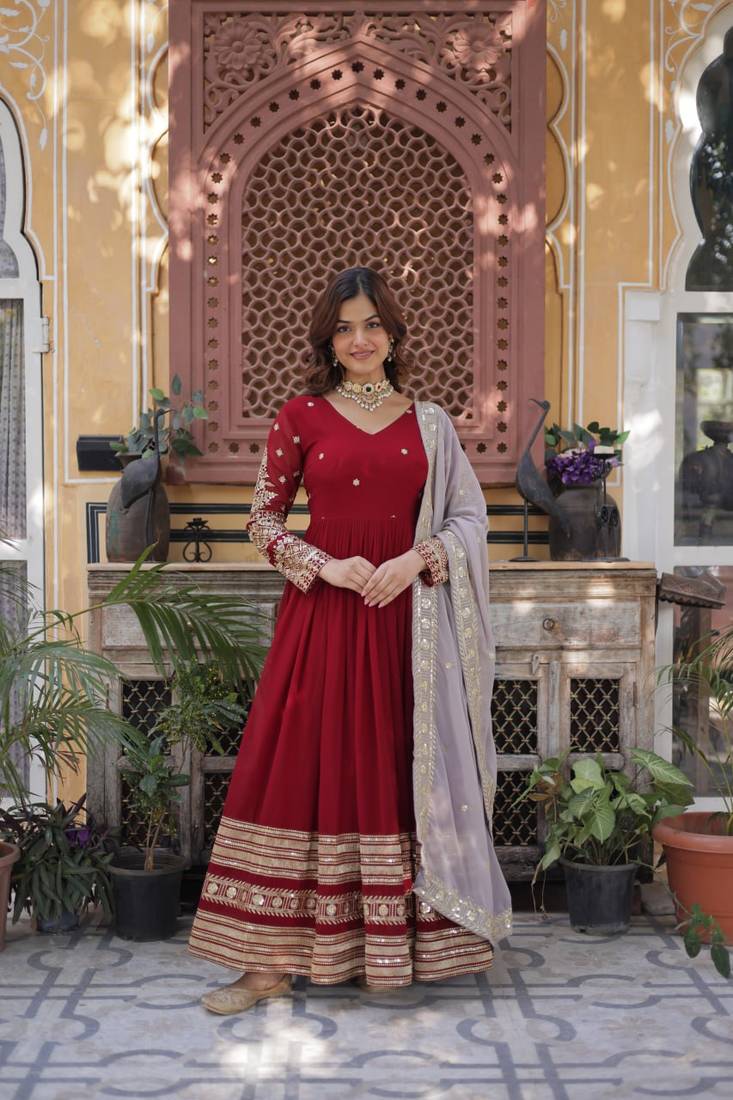 Rusty red faux blooming zari embroidered work gown