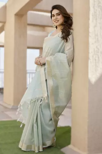 Light pista soft tissue linen silk blend saree with all-over zari linings & rich zari pallu
