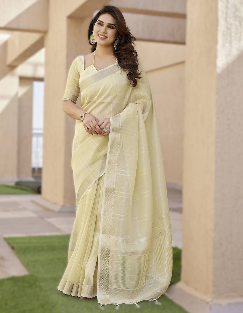 Light yellow soft tissue linen silk saree with all-over zari linings & rich zari pallu