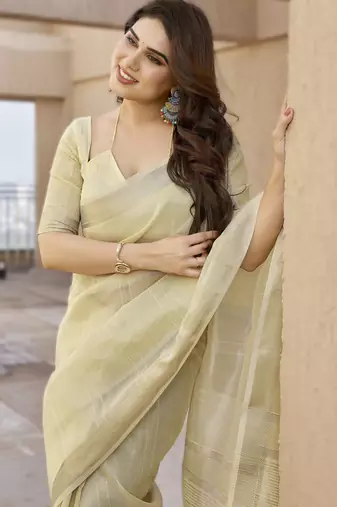 Light yellow soft tissue linen silk blend saree with all-over zari linings & rich zari pallu