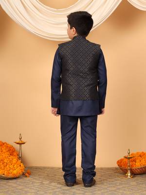 Boys navy blue cotton blend kurta pyjama set with jacquard geometric floral waistcoat 2
