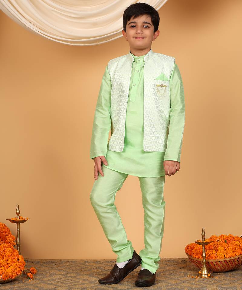 Boys light green cotton silk kurta pyjama set with jacquard elongated pattern waistcoat