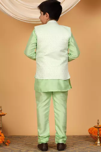 Boys light green cotton silk kurta pyjama set with jacquard elongated pattern waistcoat