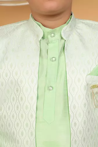 Boys light green cotton silk kurta pyjama set with jacquard elongated pattern waistcoat