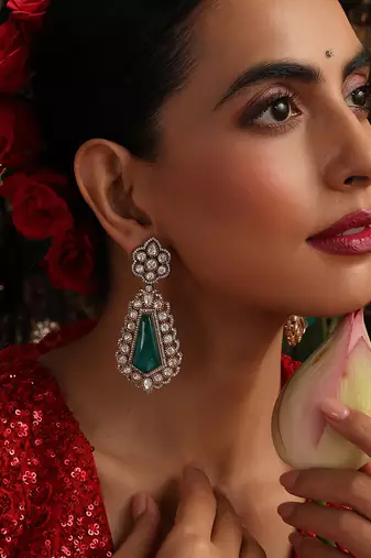 Gold plated kundan green stones dangler earrings