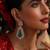 Gold plated kundan green stones dangler earrings