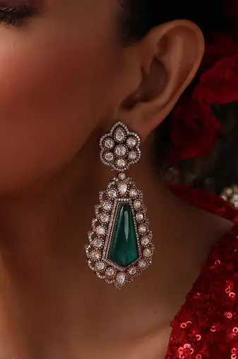 Gold plated kundan green stones dangler earrings