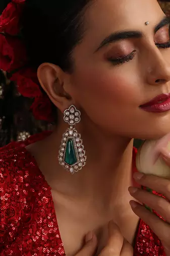 Gold plated kundan green stones dangler earrings