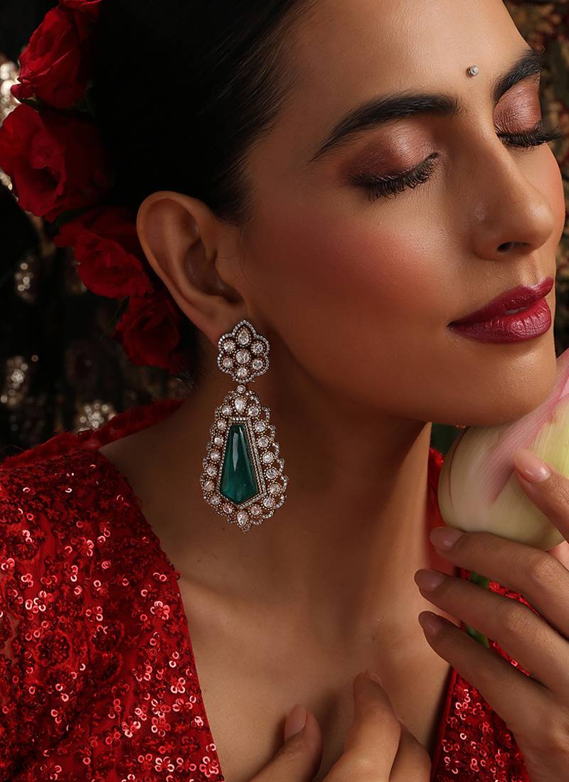 Gold plated kundan green stones dangler earrings
