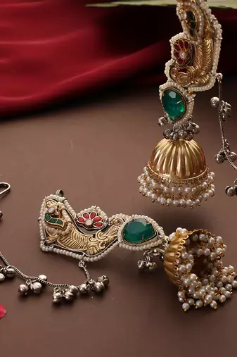 Gold plated kundan green stones jhumkas with ear chain