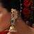 Gold plated kundan green stones jhumkas with ear chain