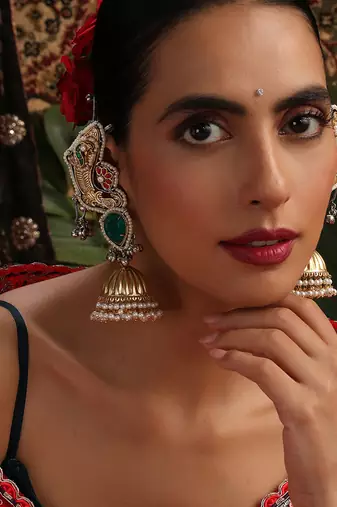 Gold plated kundan green stones jhumkas with ear chain