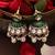 Gold plated kundan green stones jhumkas