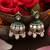 Gold plated kundan green stones jhumkas