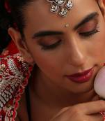 Gold plated kundan green stone mang tikka