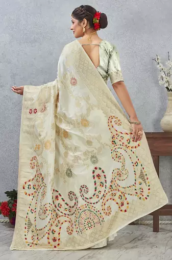 designer off white zari weaving tassel pallu work silk blend saree