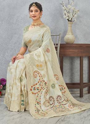 designer off white zari weaving tassel pallu work silk blend saree 4