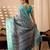 Turquoise green lichi silk saree with abstract & floral digital print and rich zari woven border with designer blouse