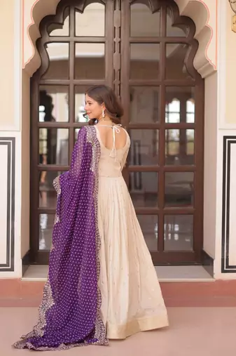 Off-white jacquard gown with purple dupatta